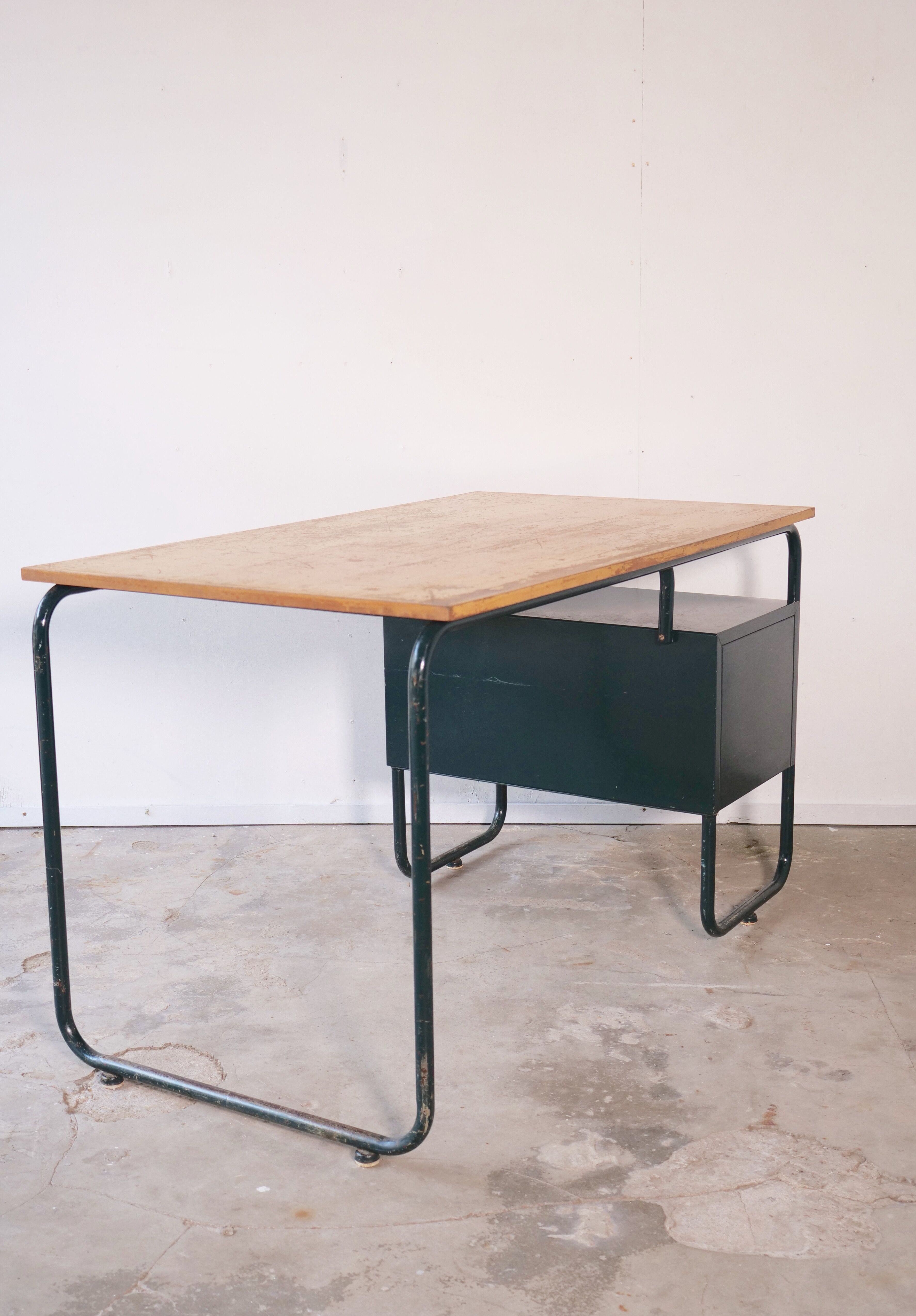 Desk with bauhaus style tubular steel chair
