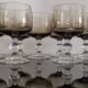 9 white wine glasses on vintage Luminarc smoked black stem