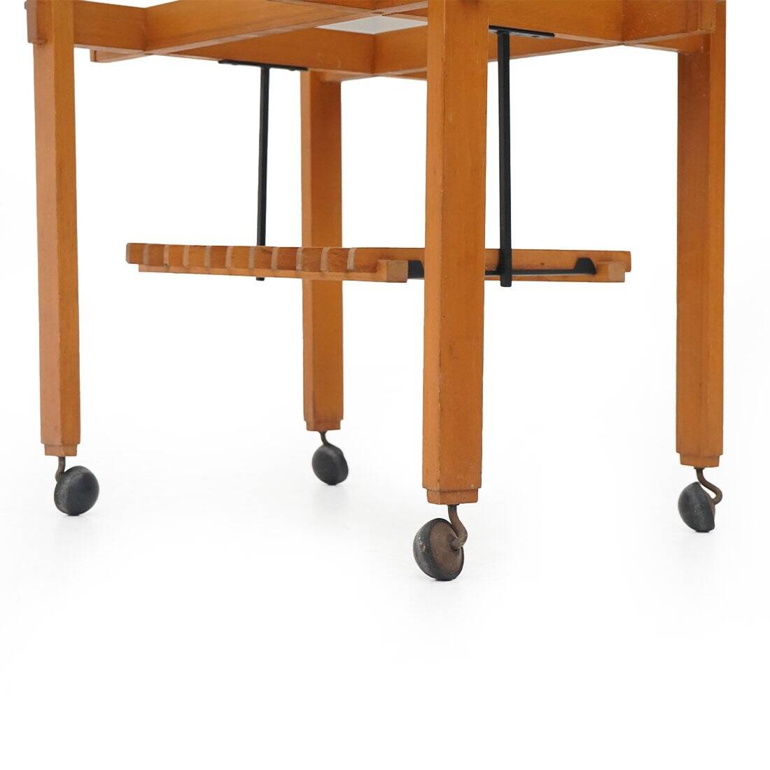 Wood and glass coffee table with wheels, 1960s.