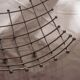 Curved grid fruit bowl, chrome metal and beads.