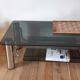 Table basse en verre fumé et pieds chromés années 70