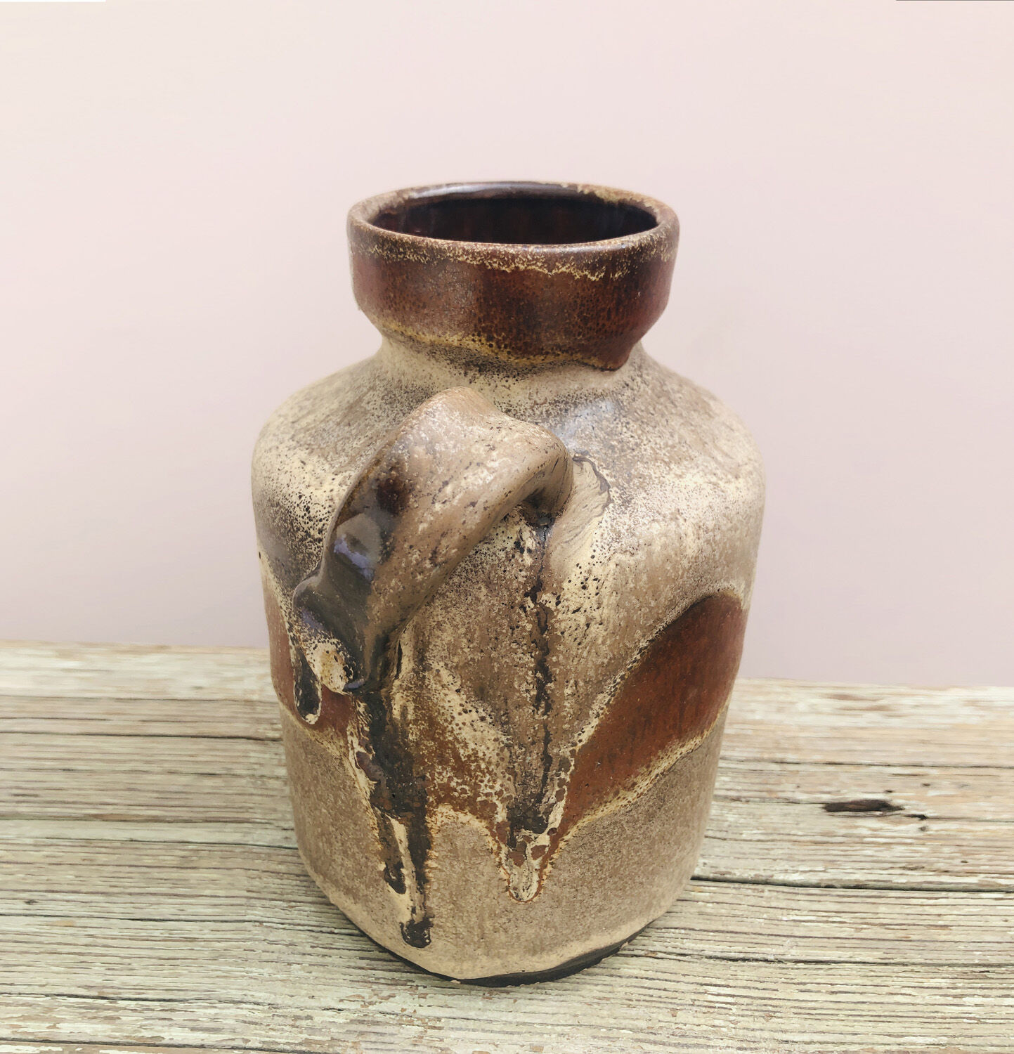 Ancient sided jug in flamed sandstone