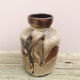 Ancient sided jug in flamed sandstone
