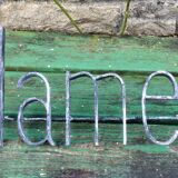 Former hairdresser sign "dames" in metal