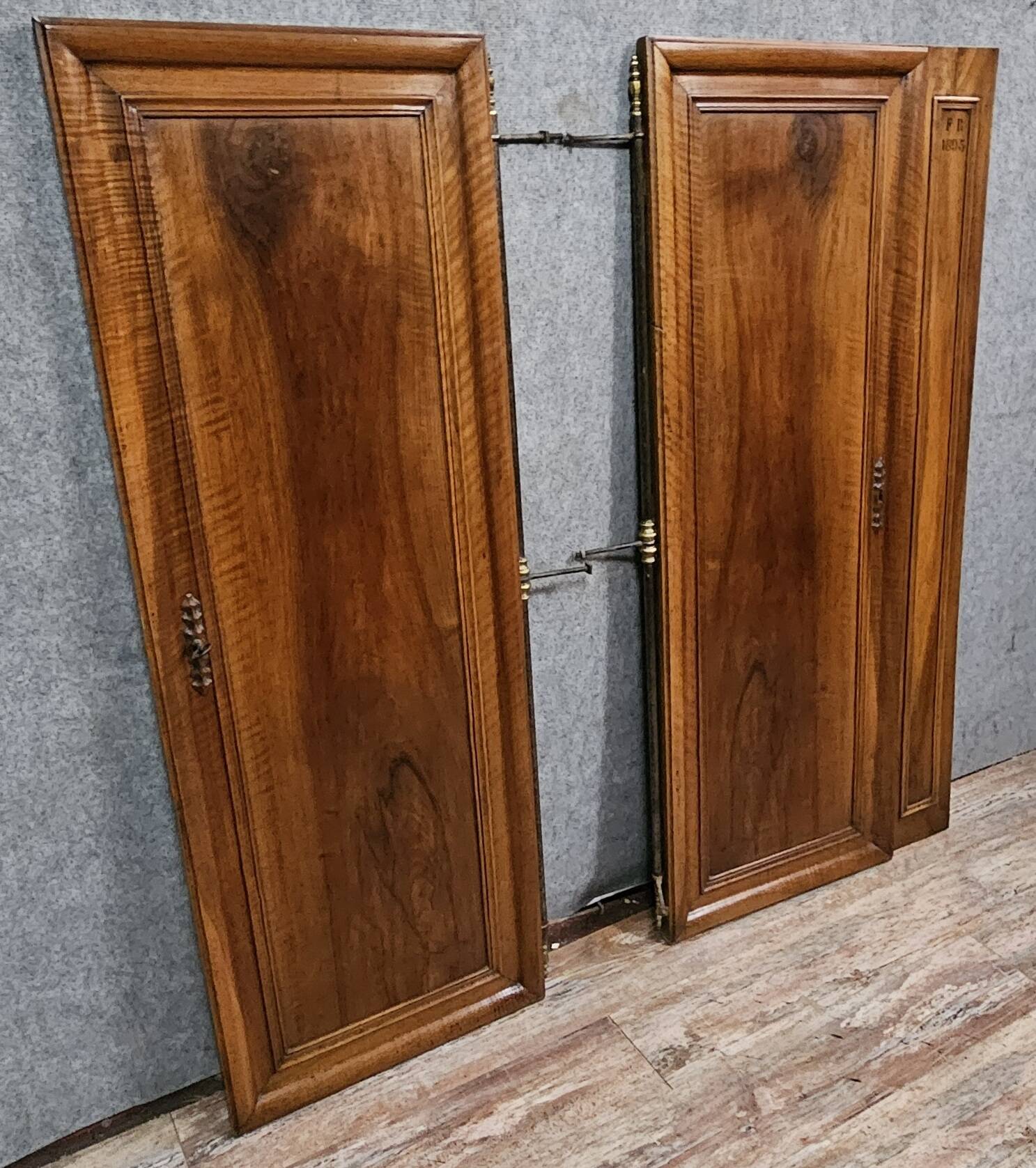 Pair of walnut wardrobe doors, dated 1895 / for cupboard