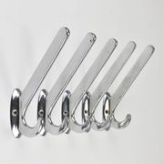 Up to 5 large Art Deco Bauhaus wall hooks in nickel and brass, Vienna, 1930s.