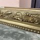 Large Louis Philippe mirror in carved gilded wood with mercury glass.