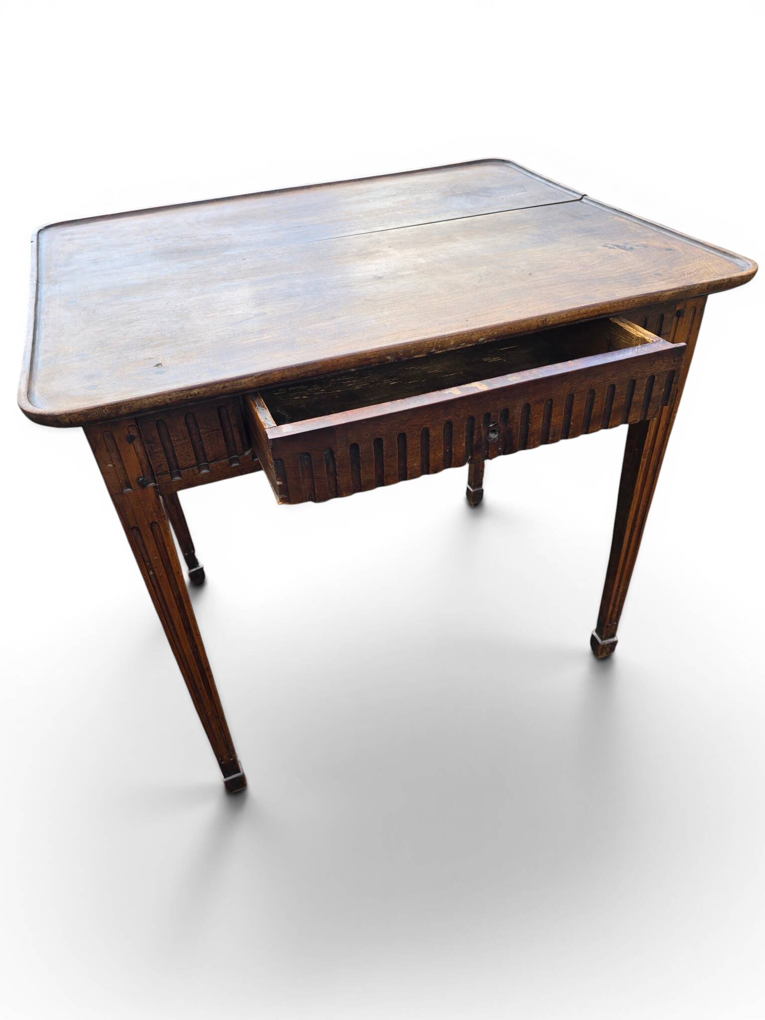 Antique game table in patinated wood in the Louis XVI style.