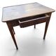 Antique game table in patinated wood in the Louis XVI style.
