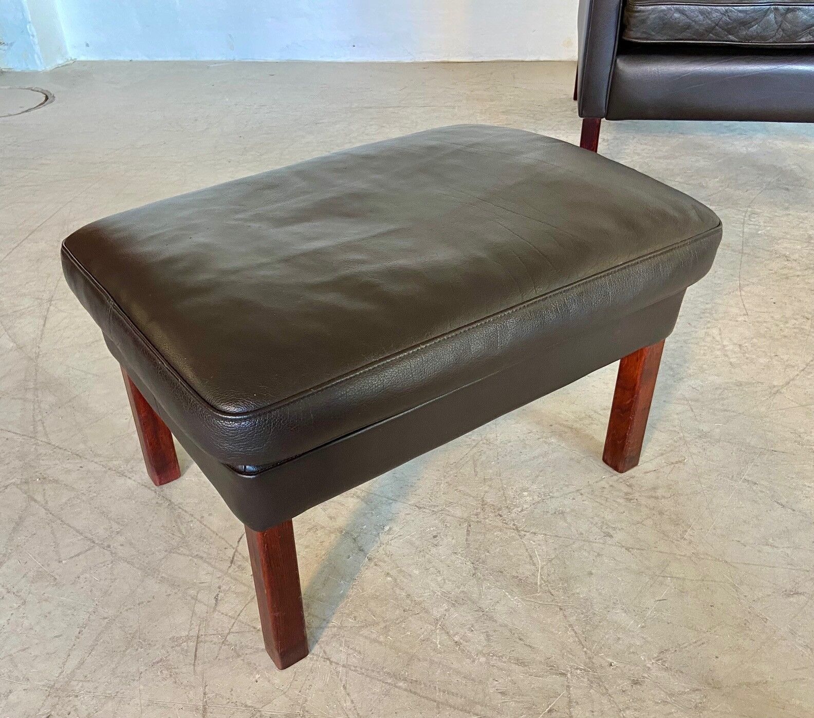 Mid-century Stouby leather lounge chair and stool in brown leather