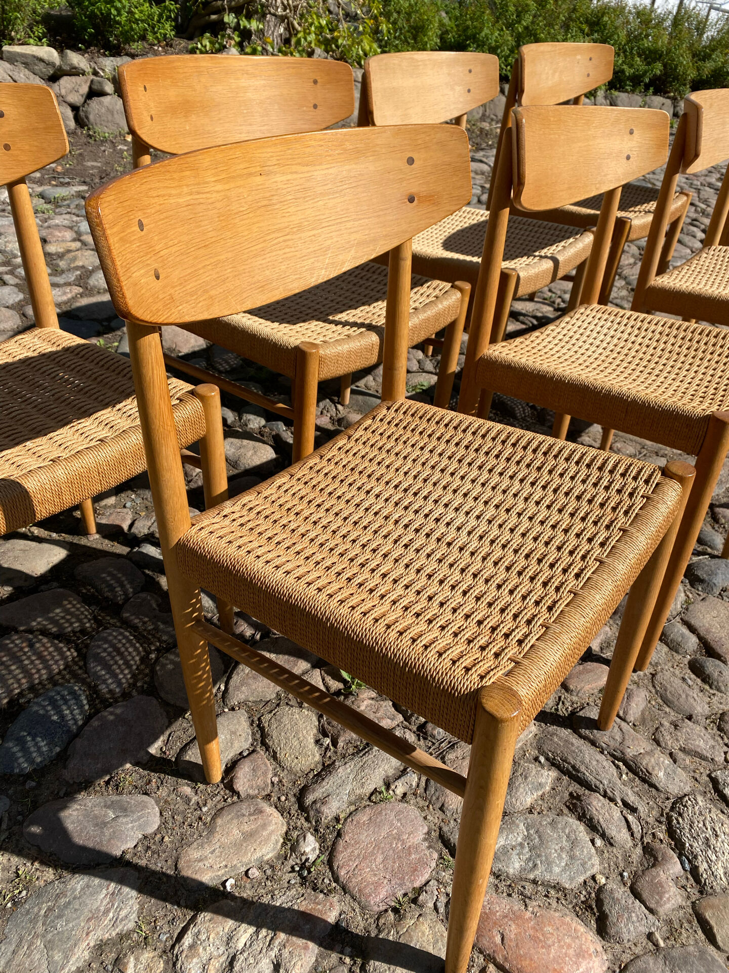 8 dining chairs in oak  w/ paper cord