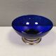 Beautiful blue glass bowl mounted on silver colored base (Original).