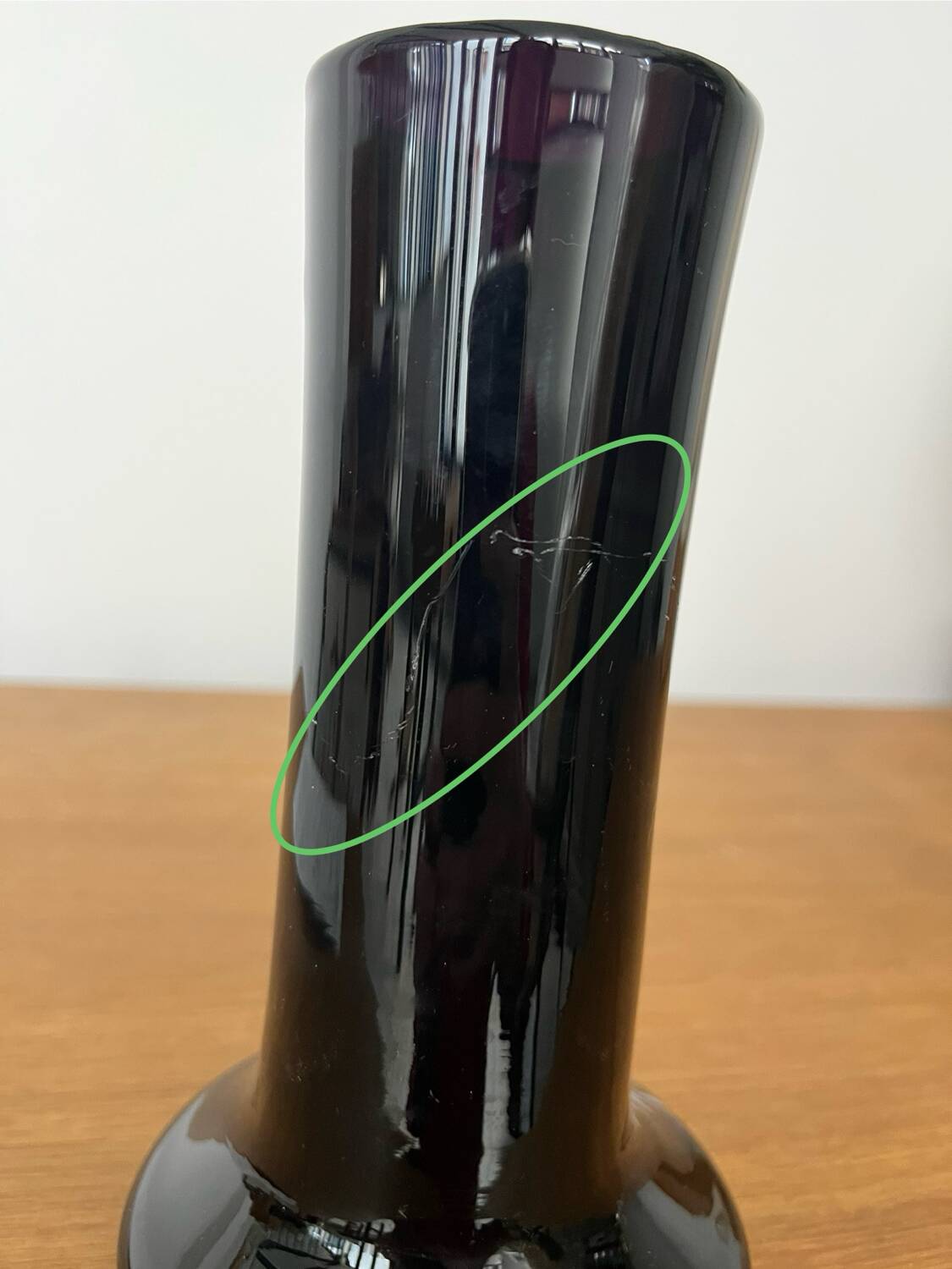 Artisanal vase in black glass with copper and blue inclusions.