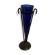 Cobalt blue vase on a metal structure.