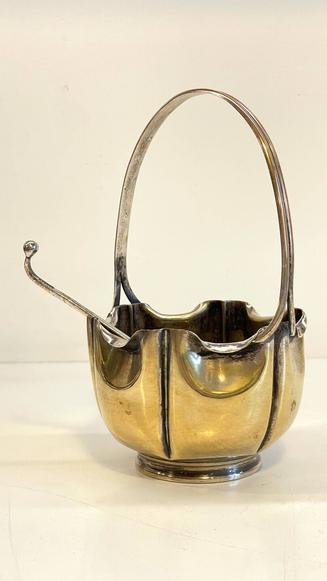 silver metal sugar bowl with gold patina