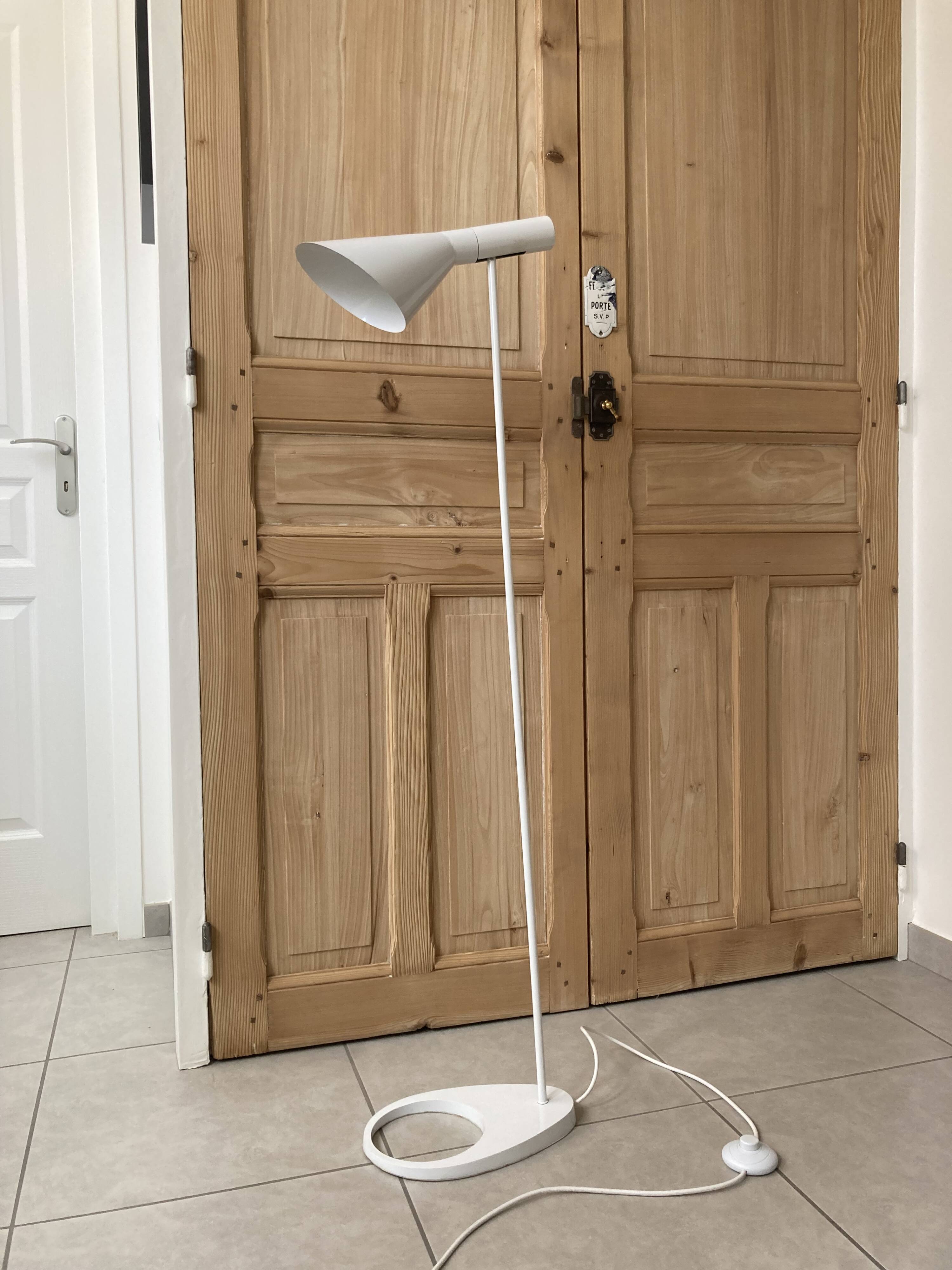 white lacquered metal reading lamp