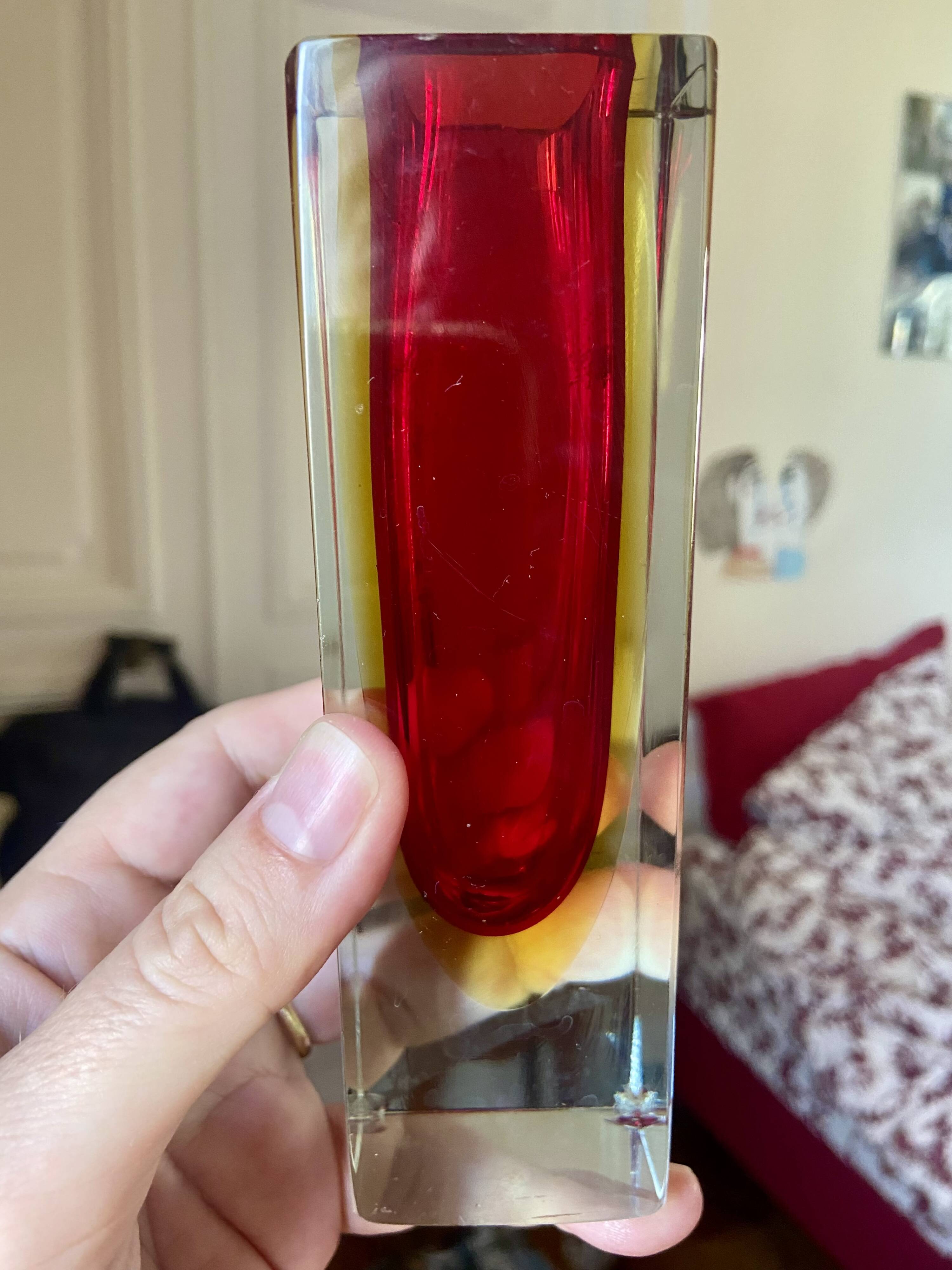 Small red vase made of Murano glass.
