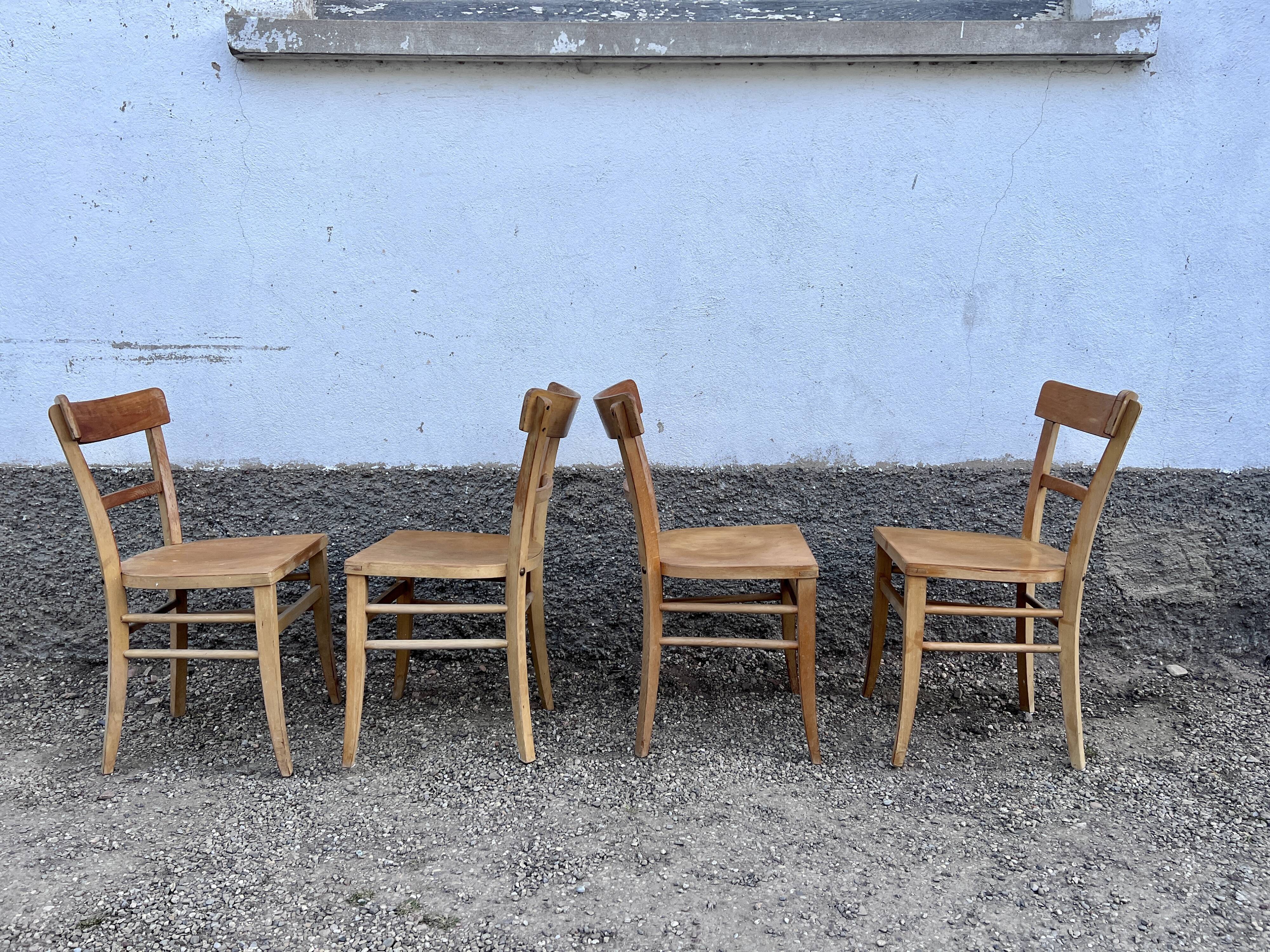 Series of 4 chairs in vintage light wood beech