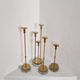Gunnar Ander, four candlesticks, brass and glass, Ystad Metall, Swedish modern.
