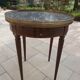 Gray marble mahogany pedestal table and brass gallery