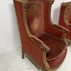 Two Louis XVI style wing chairs in gilded wood, 20th century