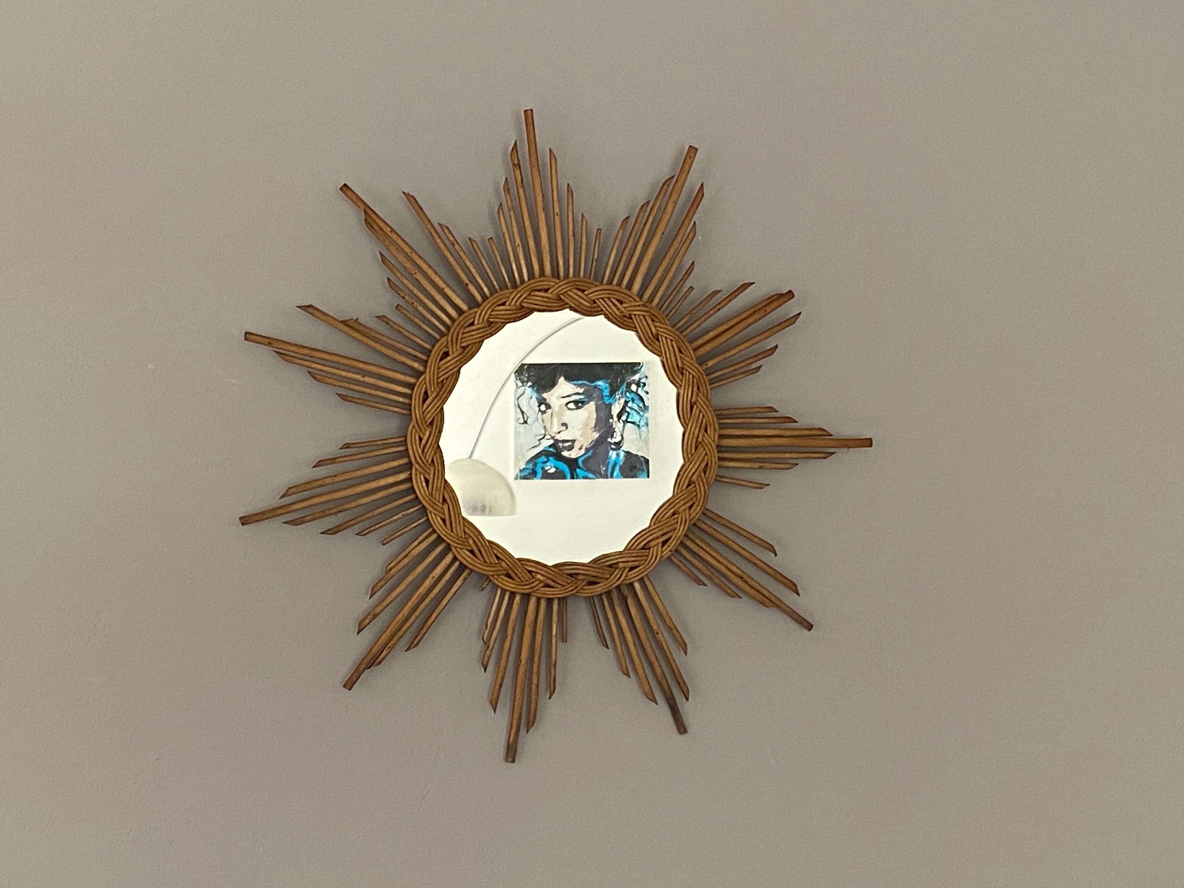 Sun mirror in braided rattan. 1960. 50cm.