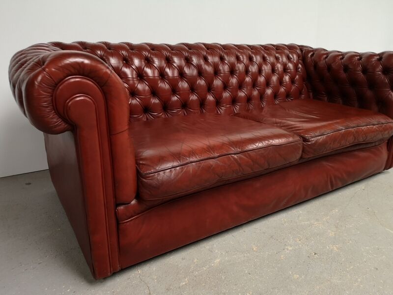 Old red leather Chesterfield sofa