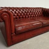 Old red leather Chesterfield sofa
