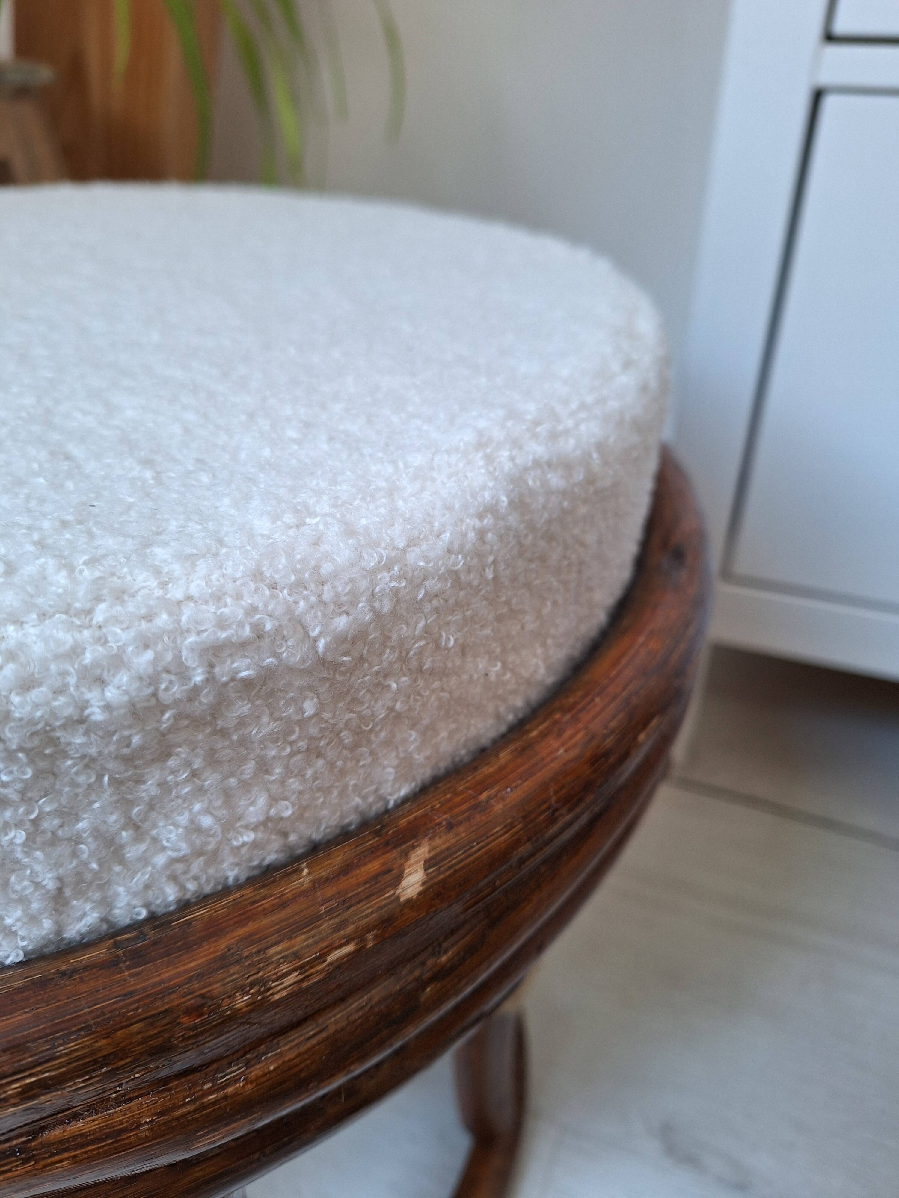 Rattan and boucle fabric pouf