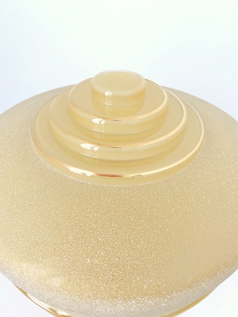 Old globe table lamp in beige and gold glass