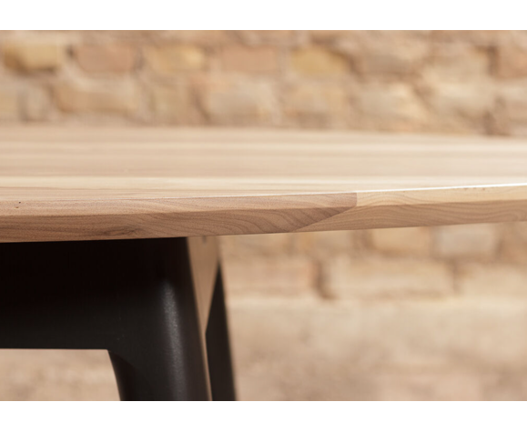 Oval dining table in solid walnut on solid beech base painted black