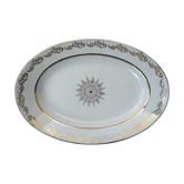 Plat ovale en porcelaine .signé LJ & cie