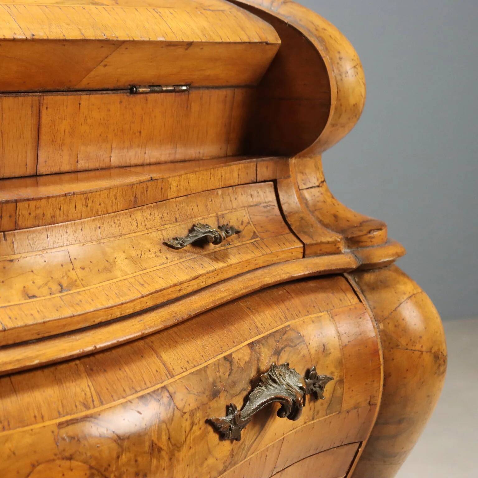 Antique drop-leaf secretary in baroque style made of walnut and maple, 20th century.