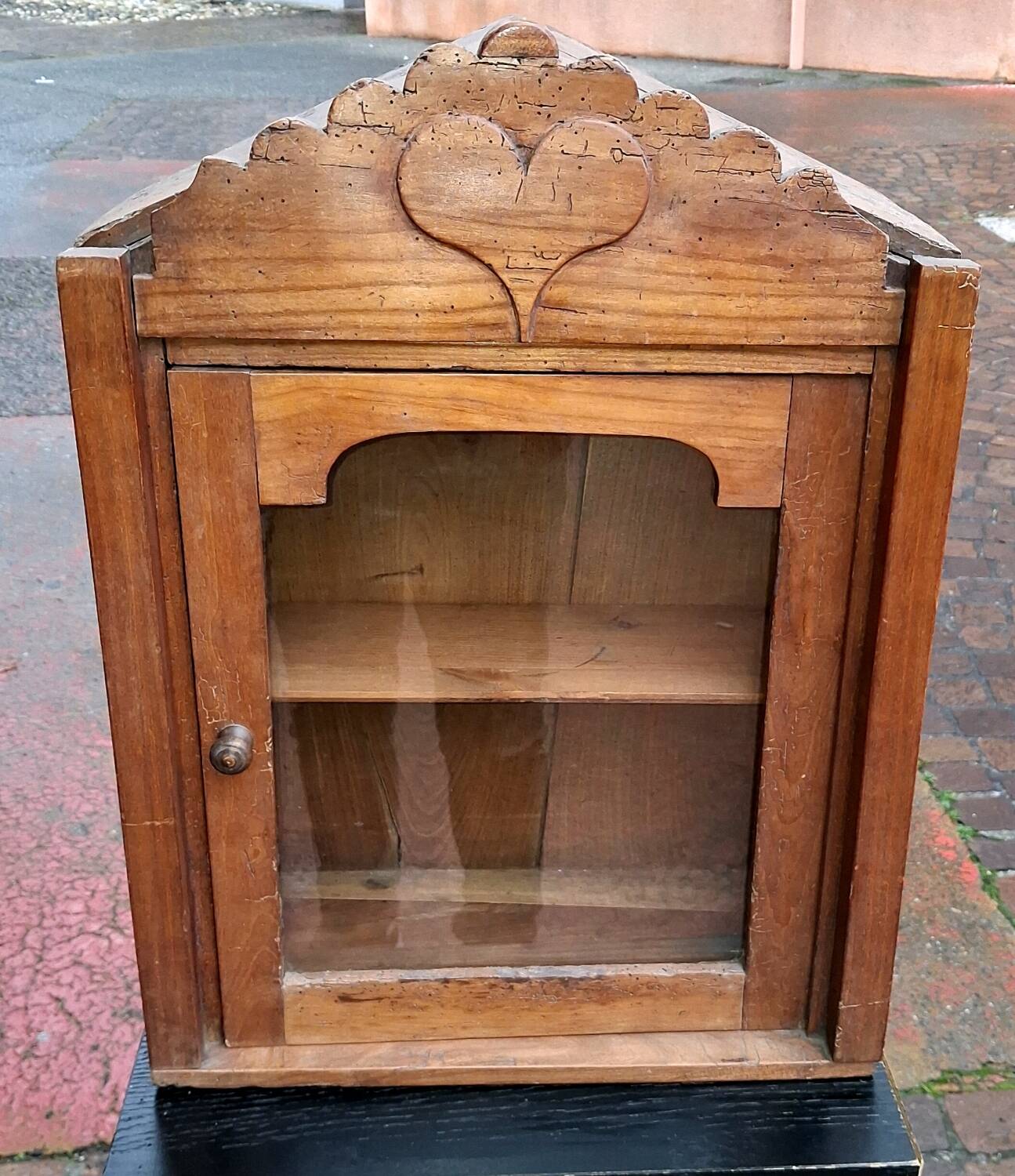 Showcase of popular art in solid wood, carved heart.