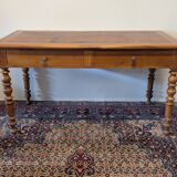 Cherry wood desk with a leather top.