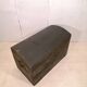 Large travel trunk in blackened wood