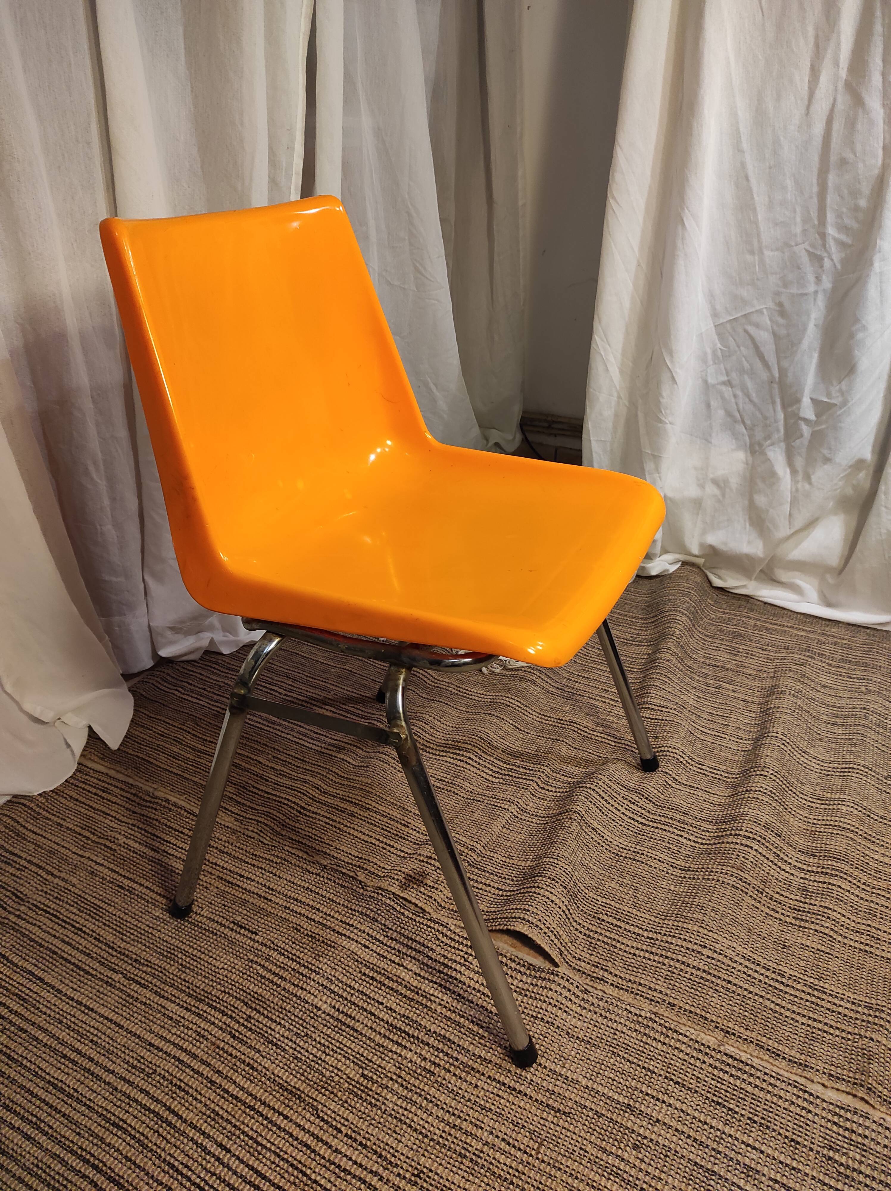 Orange plastic chair 1970