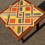 Wooden table with geometric decoration