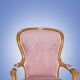 Fauteuil rose en bois