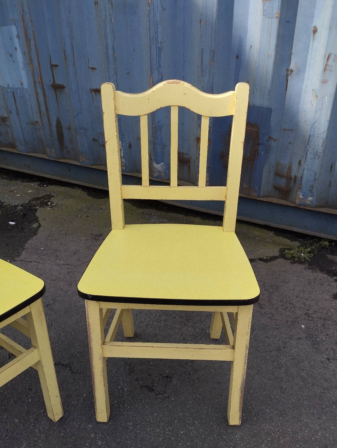 Pair of wooden and yellow formica chairs