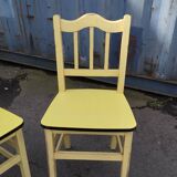 Pair of wooden and yellow formica chairs