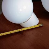 Two opaline glass globe wall lights