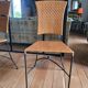 Glass and metal table and its 4 wicker chairs and glass Roche Bobois