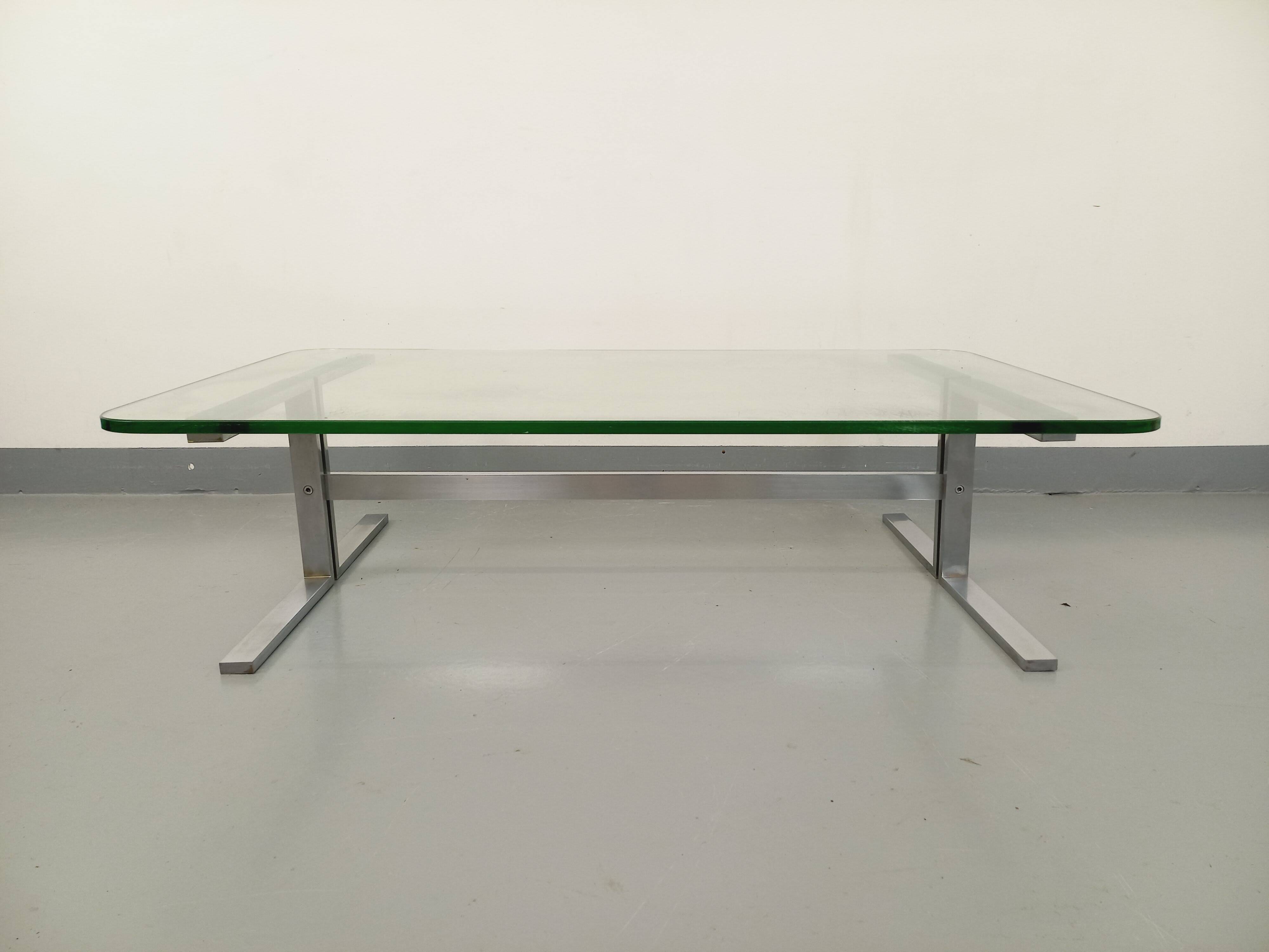Vintage coffee table in transparent glass and cast aluminum from the 70s