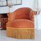 Fauteuil crapaud en velours doré