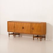 Itaian mid century teak sideboard with black glass top and inlays, 1970s