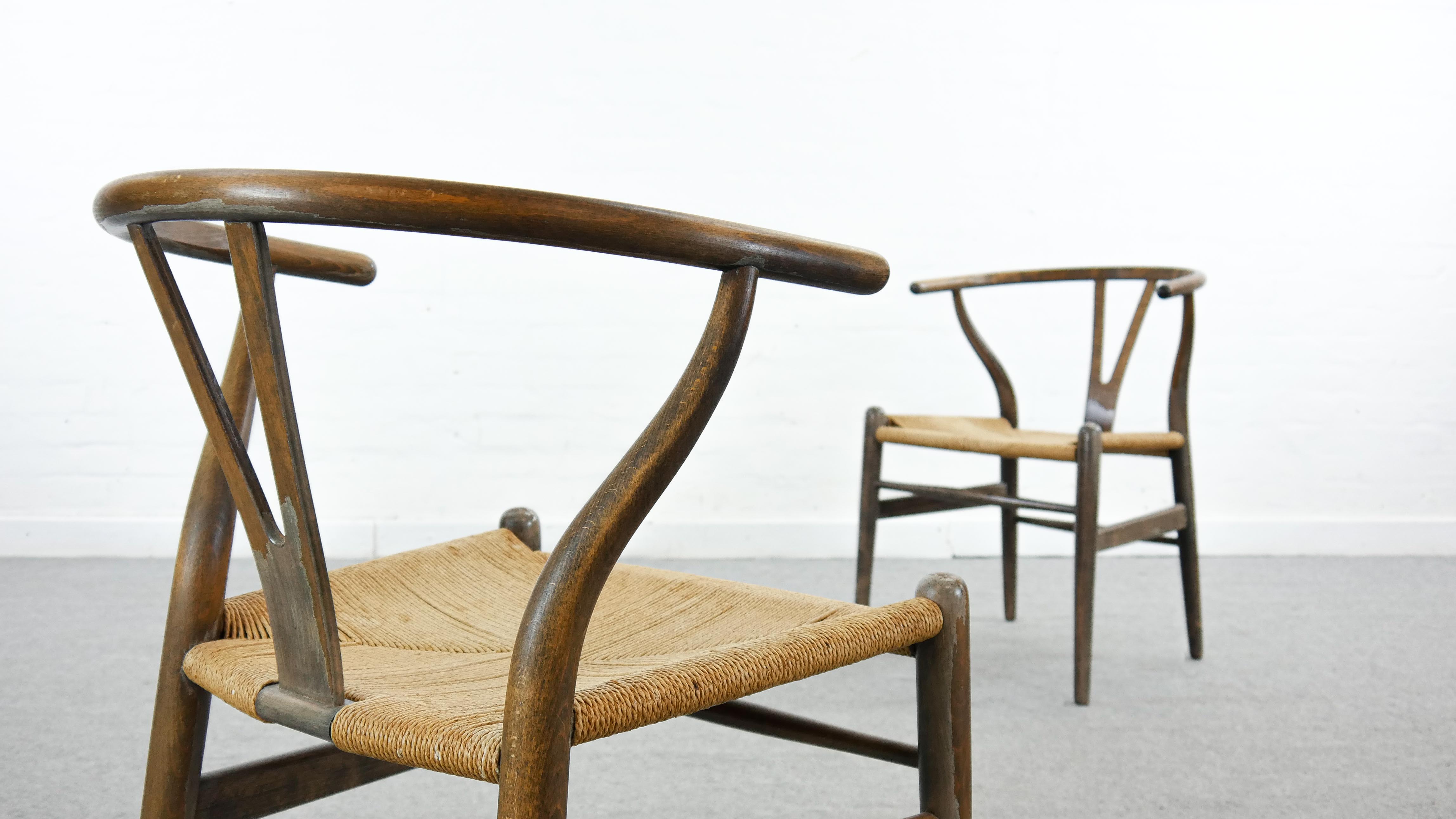 Pair of CH24 wishbone dining chairs by Hans Wegner for Carl Hansen Denmark