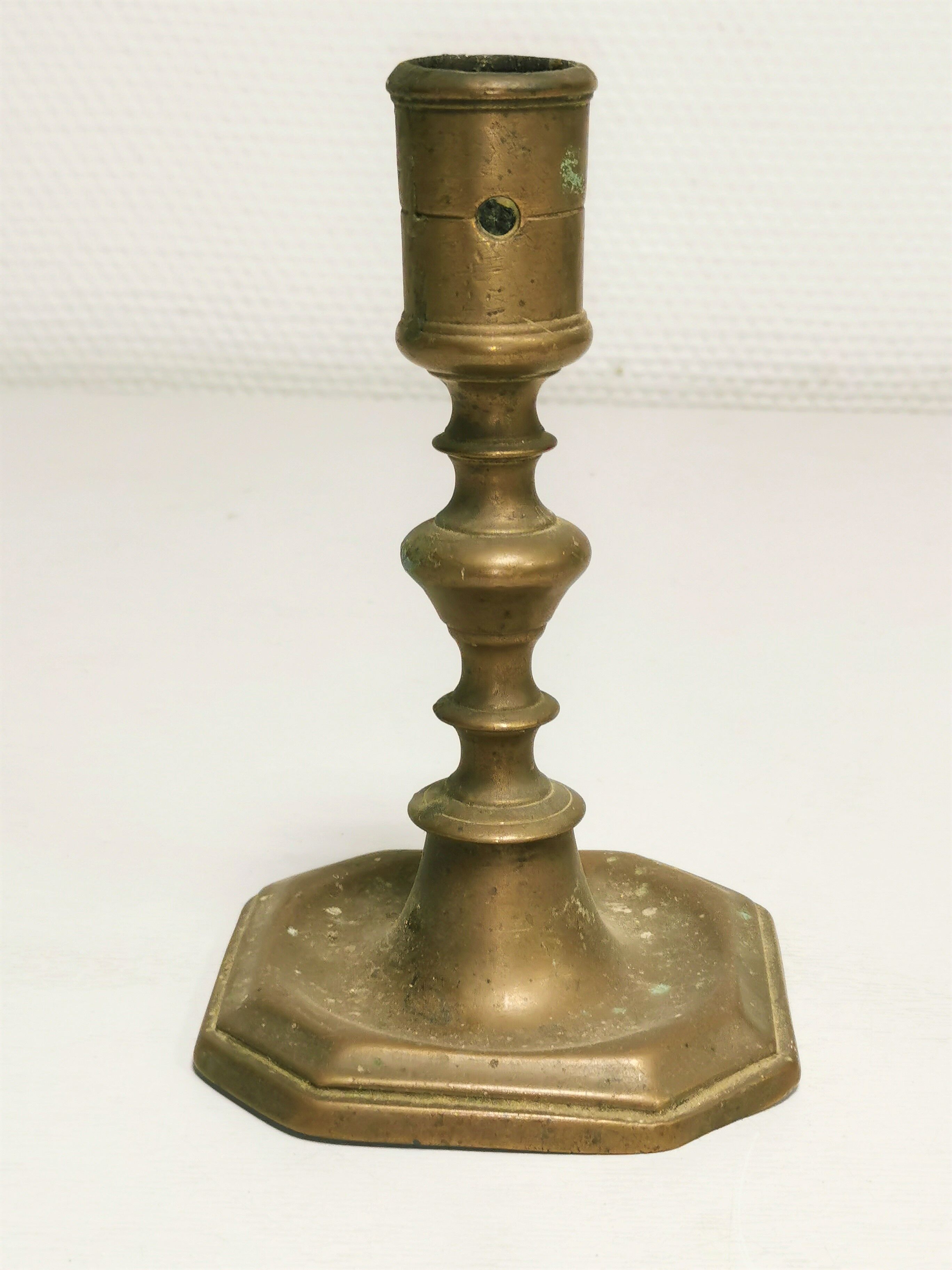 Old bronze candle holder, seventeenth century