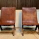 Ensemble de 2 fauteuils à dossier haut en cuir espagnol par Pierre Lottier, années 1950.