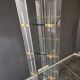 Etagère design 70 en verre plexi et laiton